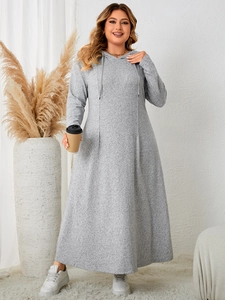 Detail of grey hooded A-line maxi dress showing soft knit texture and drawstring hood