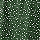 Macro shot of dark green fabric with white polka dot pattern and printed texture detail