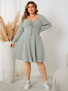 Detail of plus size square neck dress in sage green ribbed fabric with lace-up front