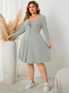 Detail of sage green plus size ribbed dress with sweetheart neckline and bow tie