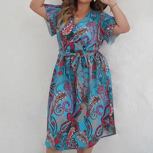Elegant lake blue V-neck dress with paisley print and waist tie for a stylish summer look
