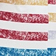 Macro shot of colorful striped print on dress with artistic cracked texture detail
