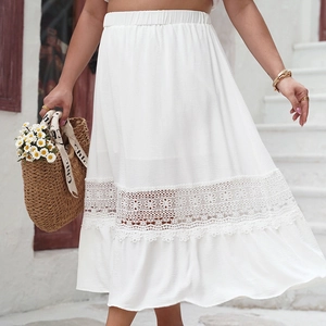 Detail of white high-waist skirt with floral lace hollow stitching and elastic waist