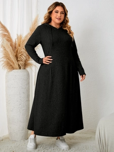 Full-body view of plus size black long sleeve hooded maxi dress with A-line hem
