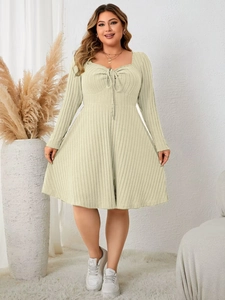 Detail of light green ribbed plus size dress featuring sweetheart neckline and drawstring