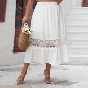Detail of bohemian white midi skirt with intricate hollow lace crochet and ruffled hemline