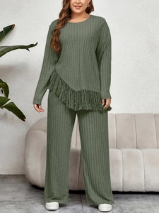 Detailed close-up of sage green knit lounge set featuring asymmetric fringe hem and ribbed fabric