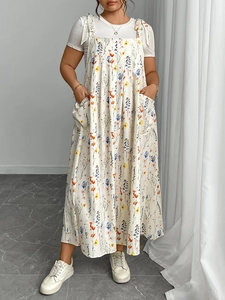 Detailed close-up of summer floral camisole dress with large side pockets and tie straps