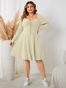 Detail of plus size rib knit dress showing sweetheart neckline with drawstring tie