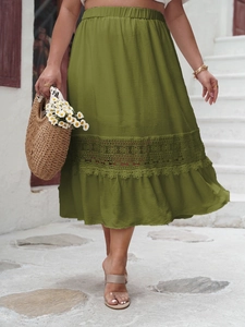 Detailed view of olive green high-waisted midi skirt with floral lace inserts and ruffles