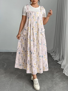 Detail of floral spaghetti strap maxi dress with bow shoulder ties and white t-shirt
