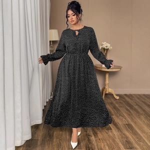 Elegant black polka dot long sleeve dress with waist tie and A-line skirt