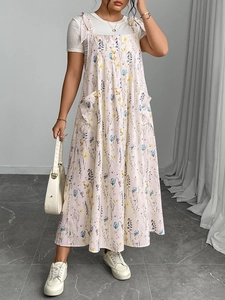 Detail of floral spaghetti strap dress with shoulder ties and functional side pockets