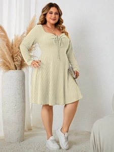 Detail of mint green plus size dress featuring ribbed texture and square neckline