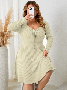 Detail of square neckline with adjustable drawstring ruching on ribbed knit dress
