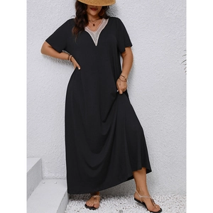 Detail of V-neckline with delicate light-colored lace trim on a black plus size maxi dress