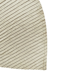 Detail shot of corduroy fabric showing fine vertical stripes and precision stitching finish