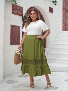 Detail of high waist olive green skirt with hollow lace stitching and ruffle hem design