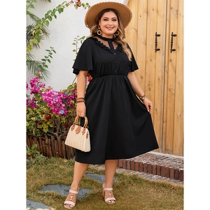 Detail of V-neck lace mesh stitching and button bodice on black plus size dress