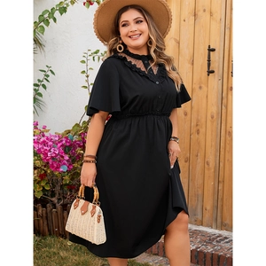 Detail of V-neck lace mesh stitching and ruffle sleeves on black plus size dress