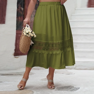 Detail of elegant olive green high waisted skirt with intricate lace embroidery and ruffles