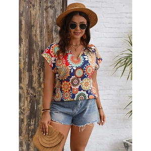 Detail of V-neck summer blouse with colorful ethnic mandala print and drop shoulder sleeves