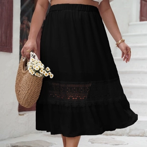 Detail of elegant high waist black skirt featuring intricate lace hollow embroidery hem