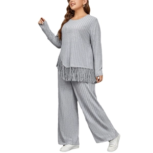 Women's grey two-piece lounge set with asymmetric fringe top and wide leg knit pants