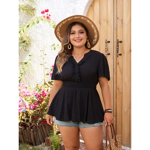 Women's plus size black V-neck peplum top with smocked waist for a slimming summer look