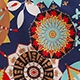 Macro detail of bohemian mandala print on summer V-neck shirt with ethnic floral patterns