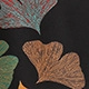 Detailed embroidery of colorful ginkgo leaves on premium black fabric blouse