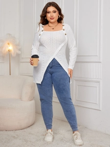 Detail of white square-neck long-sleeve blouse with decorative buttons and irregular hem