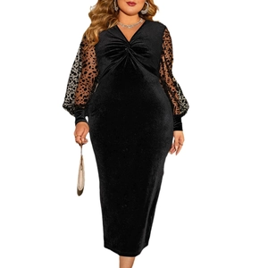 Plus size V-neck black velvet dress with leopard print mesh lantern sleeves on white background