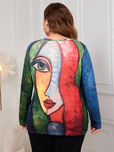 Detail view of the colorful abstract face print on the back of this long-sleeve knit top