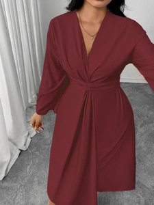 Detail view of wine red V-neck long sleeve dress with knot waist and lantern sleeve style