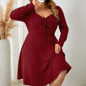 Elegant burgundy long-sleeve knit A-line dress with V-neckline and drawstring detail