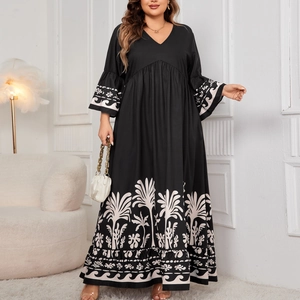 Elegant V-neck long dress with bell sleeves and white palm leaf print on black fabric