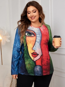 Close-up of abstract artistic face print on women's long sleeve crew neck knit top