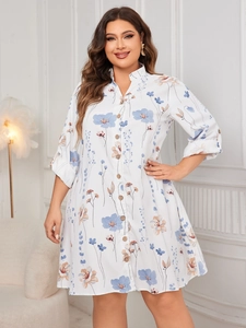 Detail of floral plus size shirt dress featuring a stand collar and button-down front