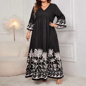 Elegant V-neck maxi dress with bell sleeves and coconut tree print in black and white