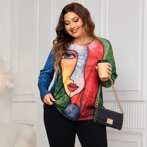 Close-up of abstract face print and knit texture on this plus size long sleeve top
