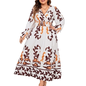 Elegant long-sleeved V-neck maxi dress with orange vine print and ruffled hemline