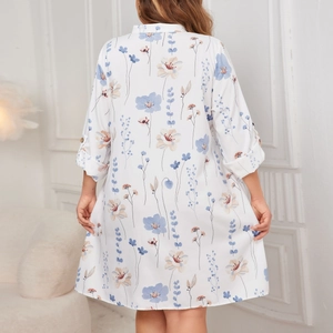 White floral plus size dress with blue botanical print and loose midi silhouette for women