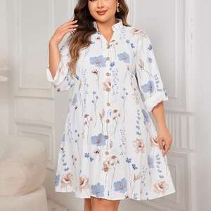 Women white floral shirt dress with long sleeves and buttons in a loose fit style