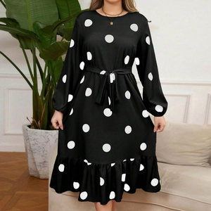 Elegant black long sleeve polka dot dress with waist belt and ruffled hemline