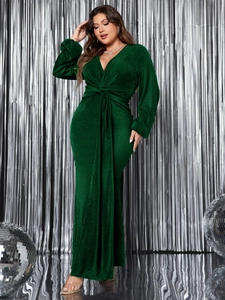 Detail of emerald green V-neck evening gown with shimmering metallic fabric and waist knot