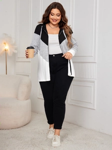 Detail of plus size striped zip-up hoodie featuring black and white contrast color blocks