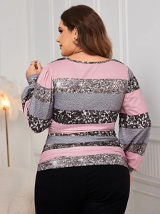 Detailed back view of pink and grey striped plus size top with sequin texture and lantern sleeves