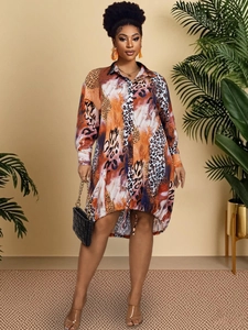 Close-up of leopard print shirt dress with polo collar and high-low hem in warm tones