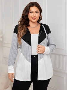 Detail view of the ribbed knit fabric and tricolor V-shape stitching on the cardigan